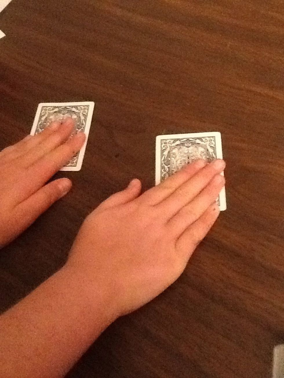 Then ask the person to put there hand on top of the other card