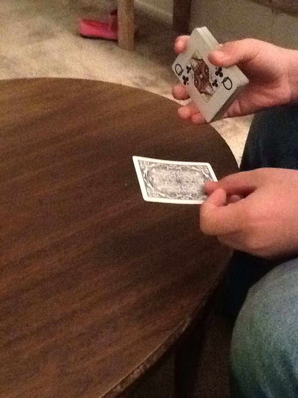 Then ask the person to put there hand over the card