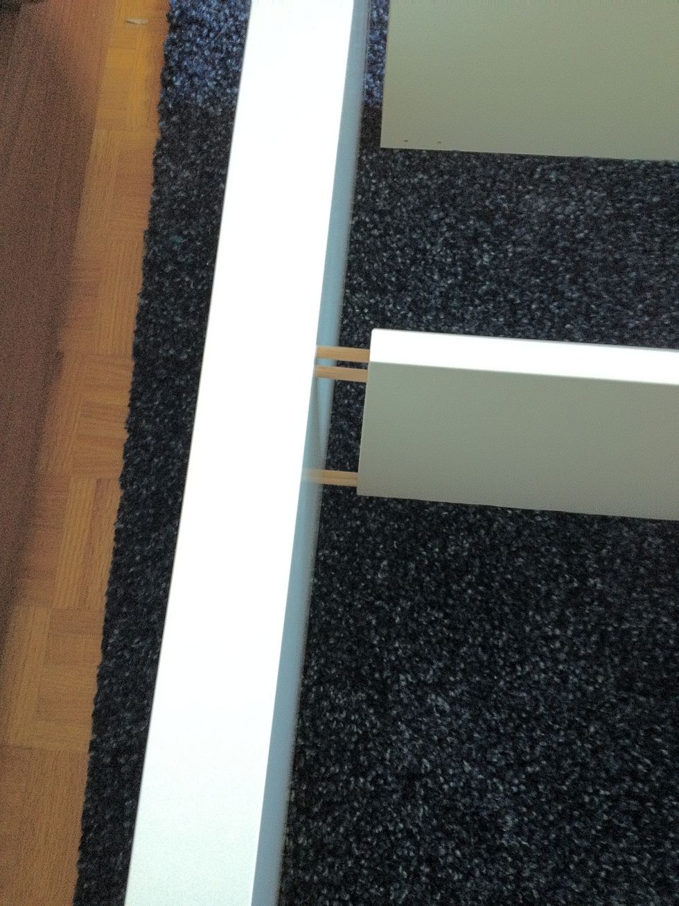 Then attach the two side pieces using the wooden pegs. Like you did earlier, but do the steps backwards.