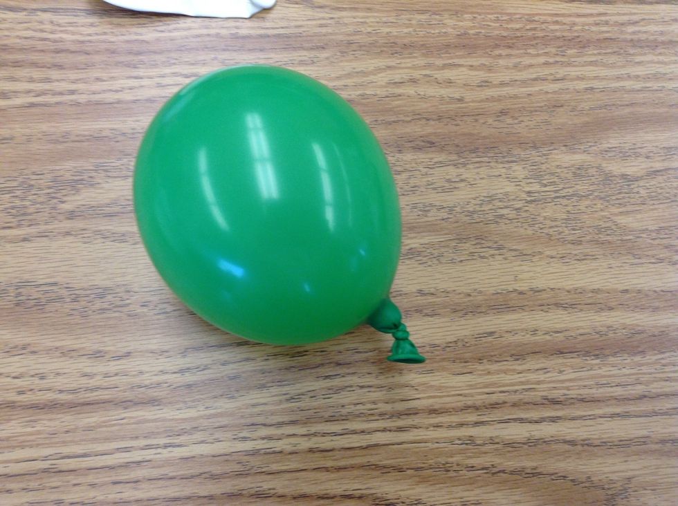 Then,blow up the balloon and tie it.