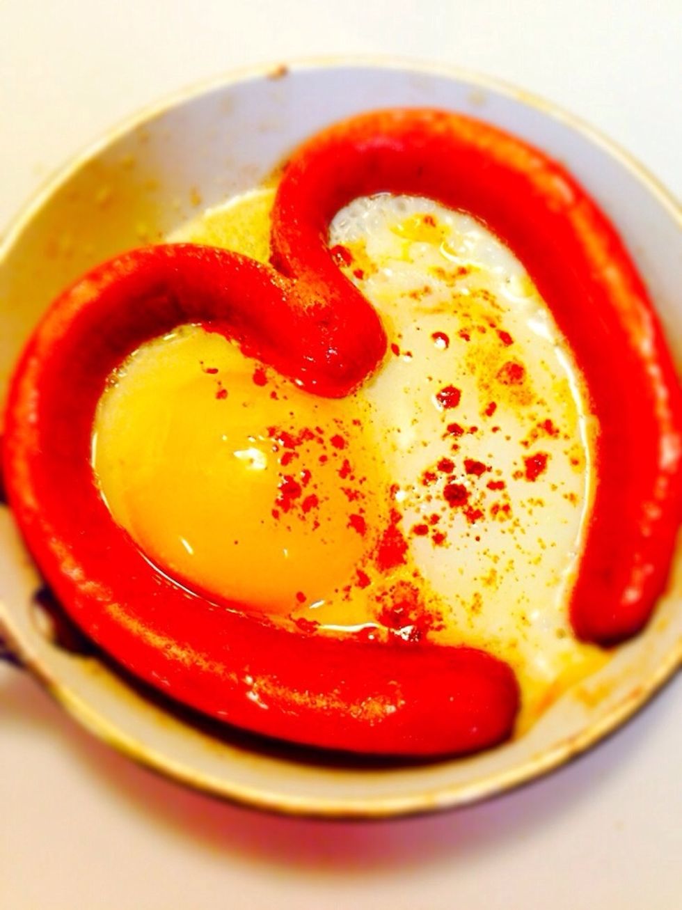Then break an egg in the middle. Fry on low heat so the egg will be cooked but not burnt