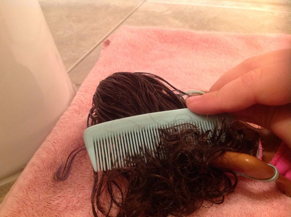 Then, brush it with the comb.