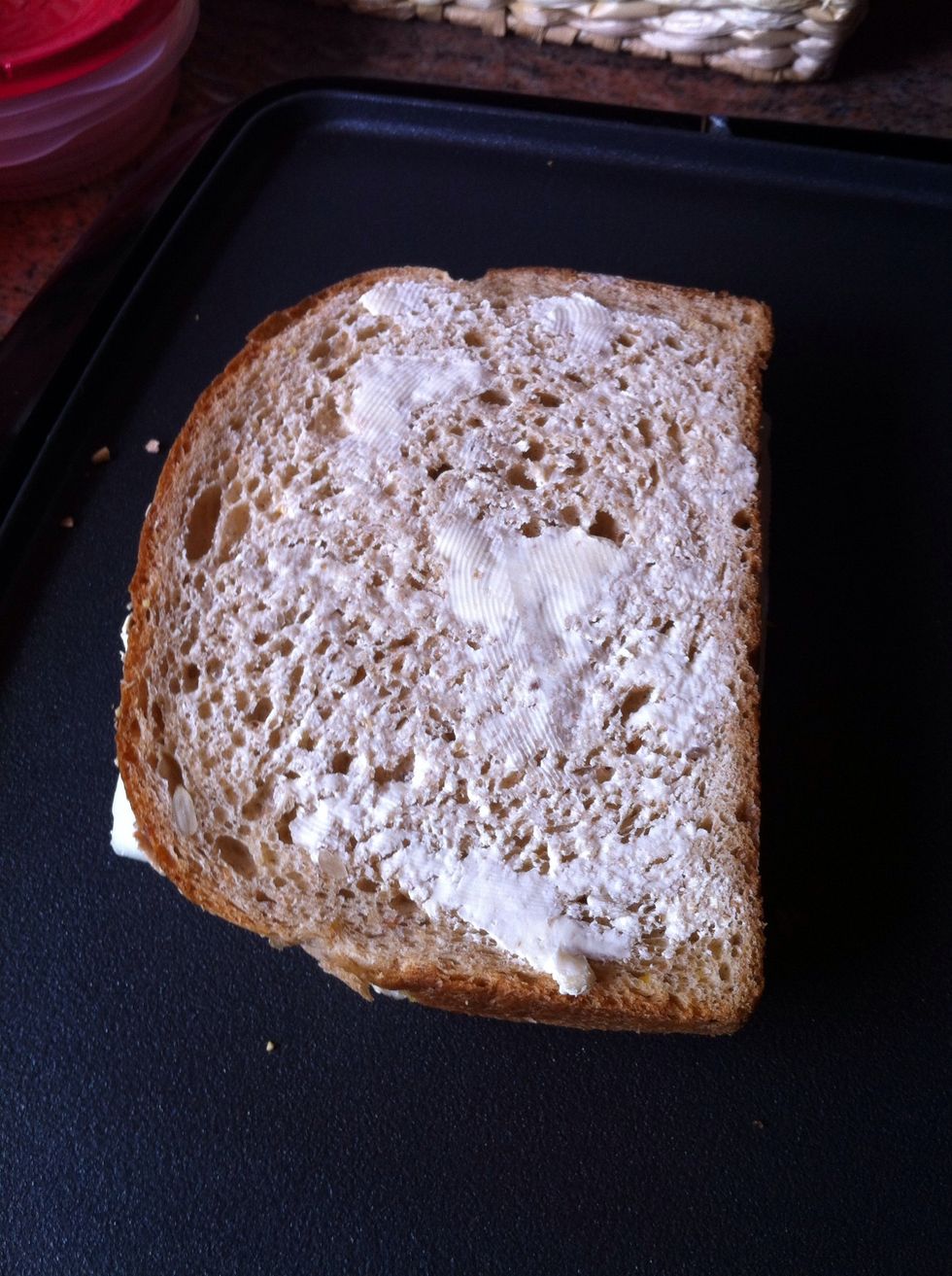 Then butter one side of the bread while on the plate and place the buttered side on the griddle. While its on the griddle, butter the other side.