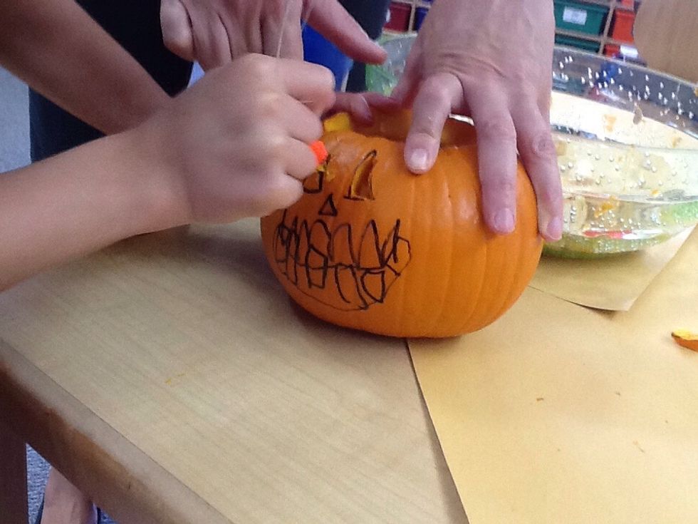 Then, carve the eyes and the nose.