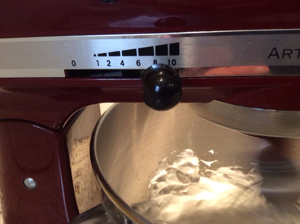 Then change the setting to 8 (medium-high) and beat for another 3 minutes or until there are stiff peaks and the mixture clumps in the whisk when you lift it.