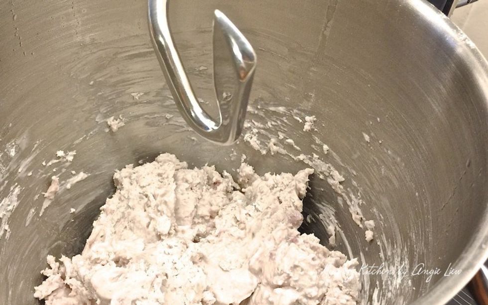 Then change to the dough hook. Using lowest speed, continue to mix for about 10 minutes, until you get a pliable dough. Alternatively, you can mash the hot steamed yam and knead the dough by hand.