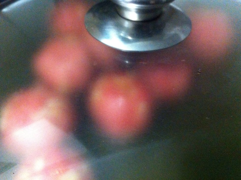 Then cover. Fairly constantly you'll want to rotate the covered pan in a circular motion so the meatballs play bumper cars and don't stick. By chance if they do stick - don't panic! Just unstick 'em!