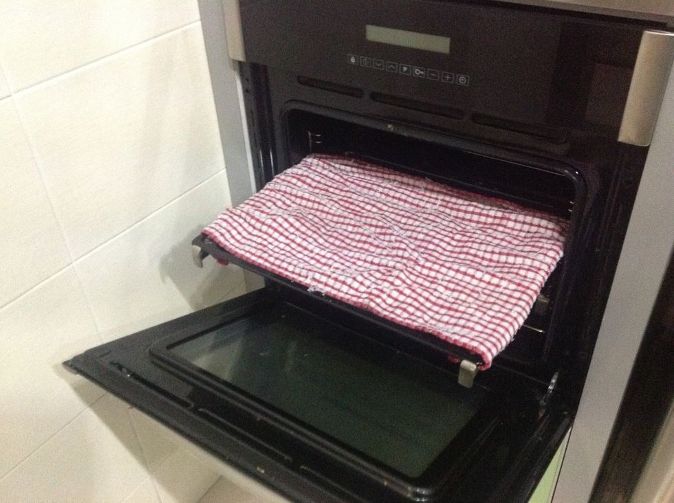 Then cover it loosely with a clean kitchen towel and again, place it in a warm place. If its the oven, make sure it's turned off! Leave it for 20-30 minutes.