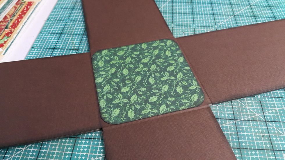 Then cover the middle with pattern paper, round the corners for perfect finish