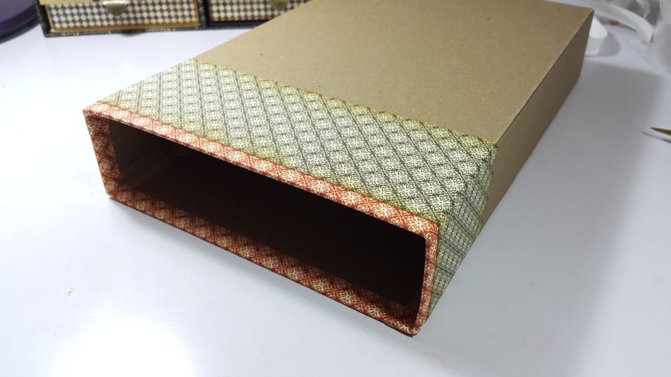 Then cover with pattern paper of 2-1/2"x12" as shown.