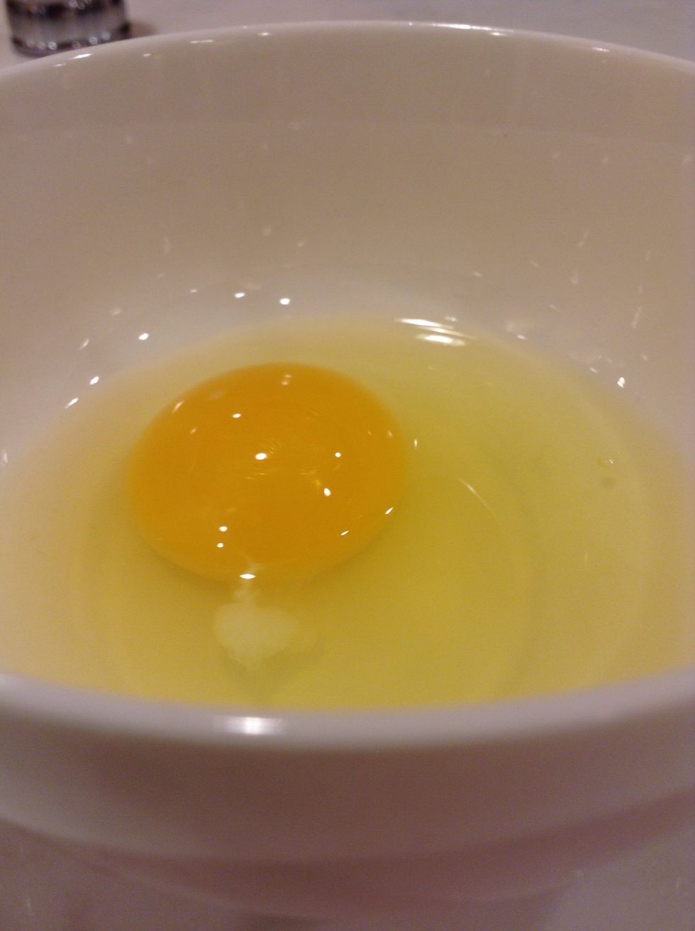 Then, crack the egg into the bowl