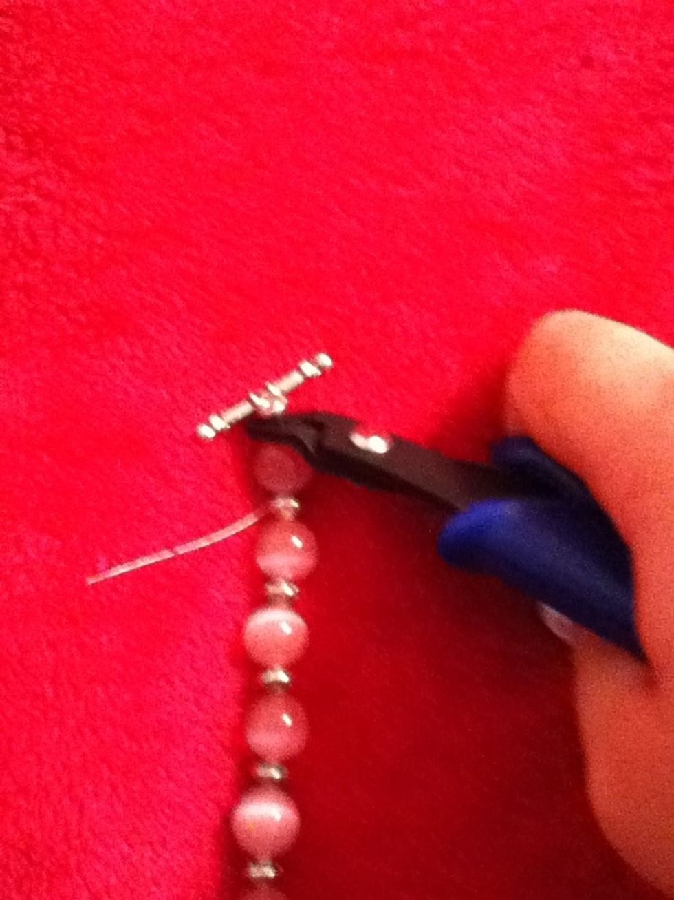 Then crimp the crimp bead with the holes closest to your hand then again with the harthest one