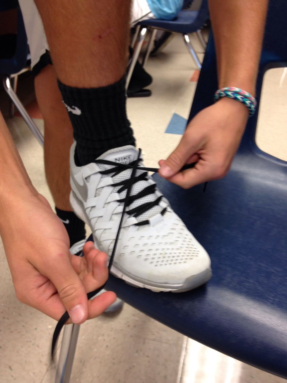 Then, criss cross the laces.