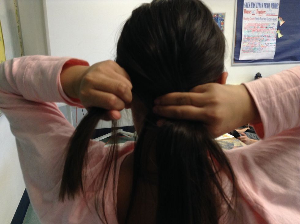 Then, Cross the left section of hair over the middle section.