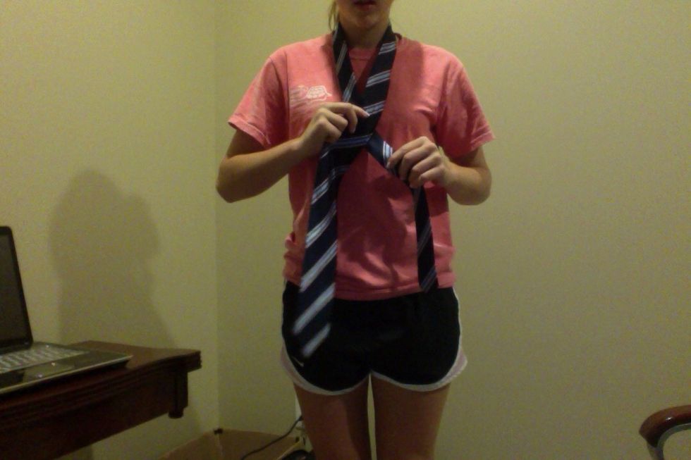 Then cross the wide end over the narrow end