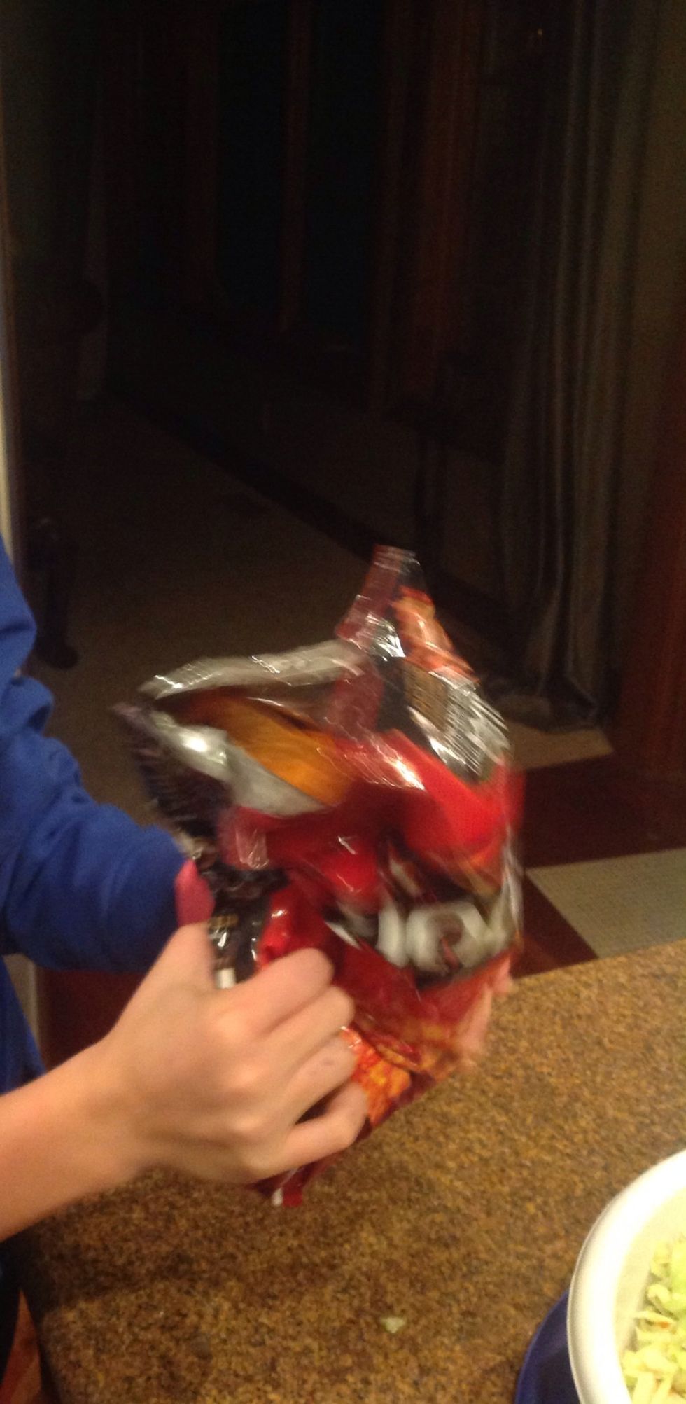 Then crush the Doritos up in the bag with your hands.