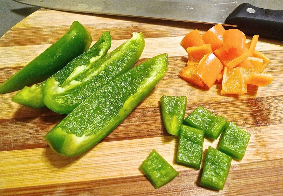 Then cut 1 green and 1 orange bell pepper into 1/2 inch pieces. These not only add colours to the chicken but also make for a healthier and flavourful dish.