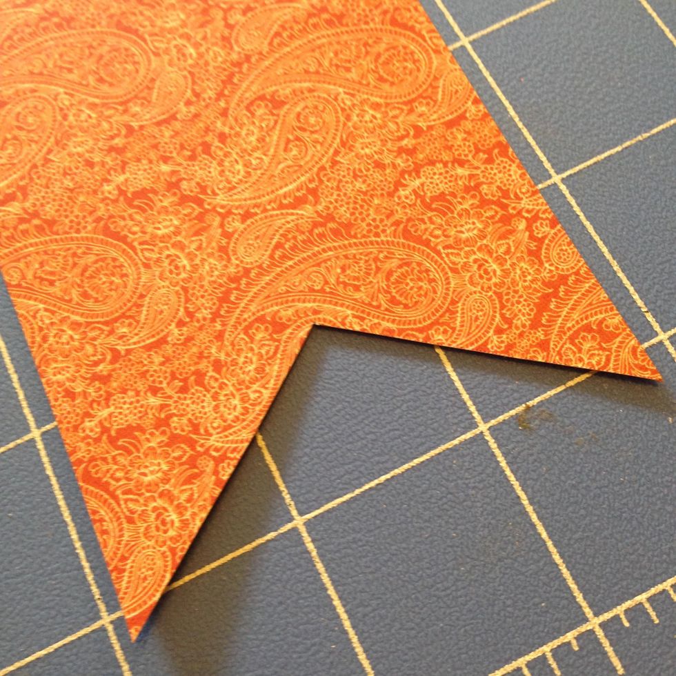 Then cut a chevron into each strip to create the flag.