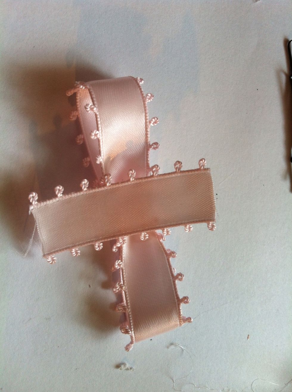Then, cut a short strip which is long enough to wrap the middle of the ribbon. ( mine is too long, so i cut it a little shorter, you can just cut the excess out after you glued)