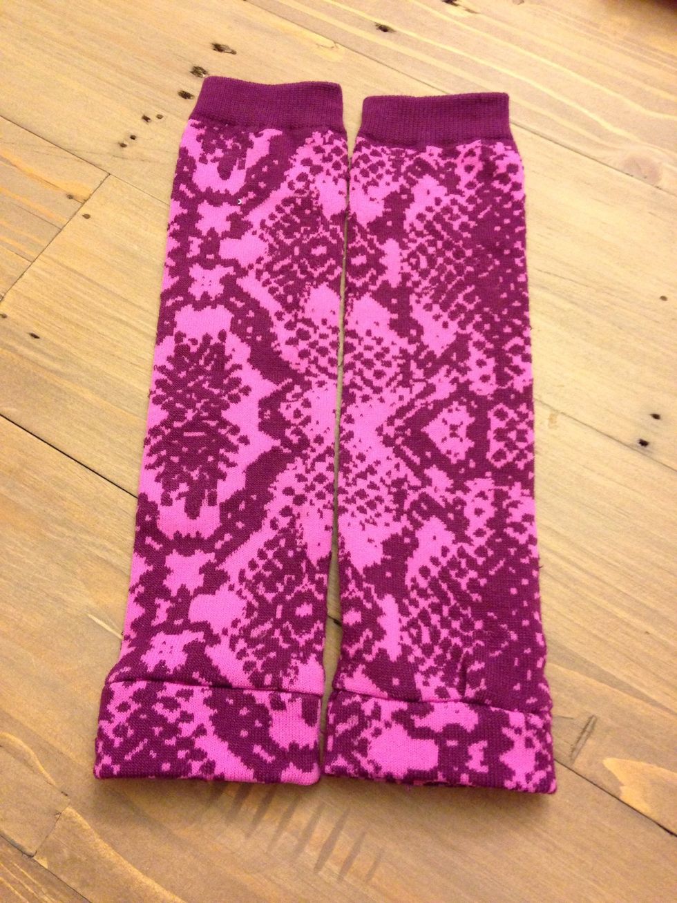 Then cut excess fabric and fold over!! Now you are done!! Just repeat to other side and you've got yourself a pair of leg warmers.