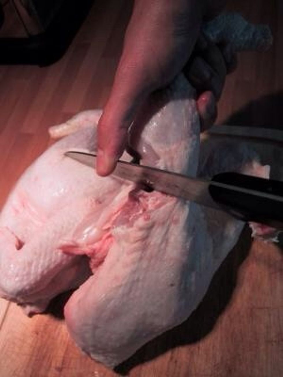 Then cut off the leg - try to cut through the middle of the joint