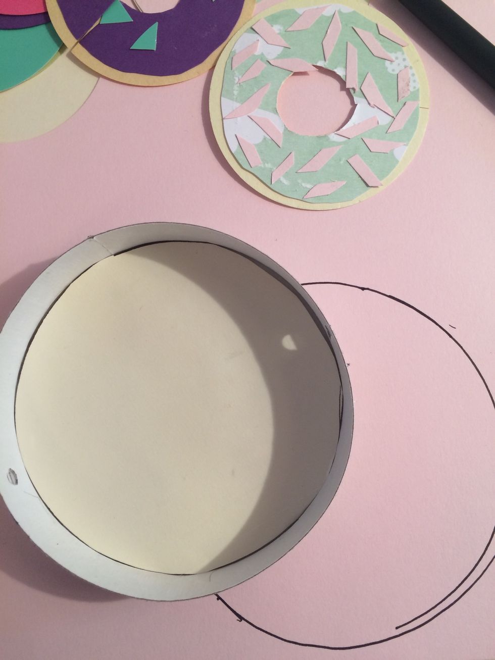 Then cut out a circle a bit smaller than the bottom for the frosting.