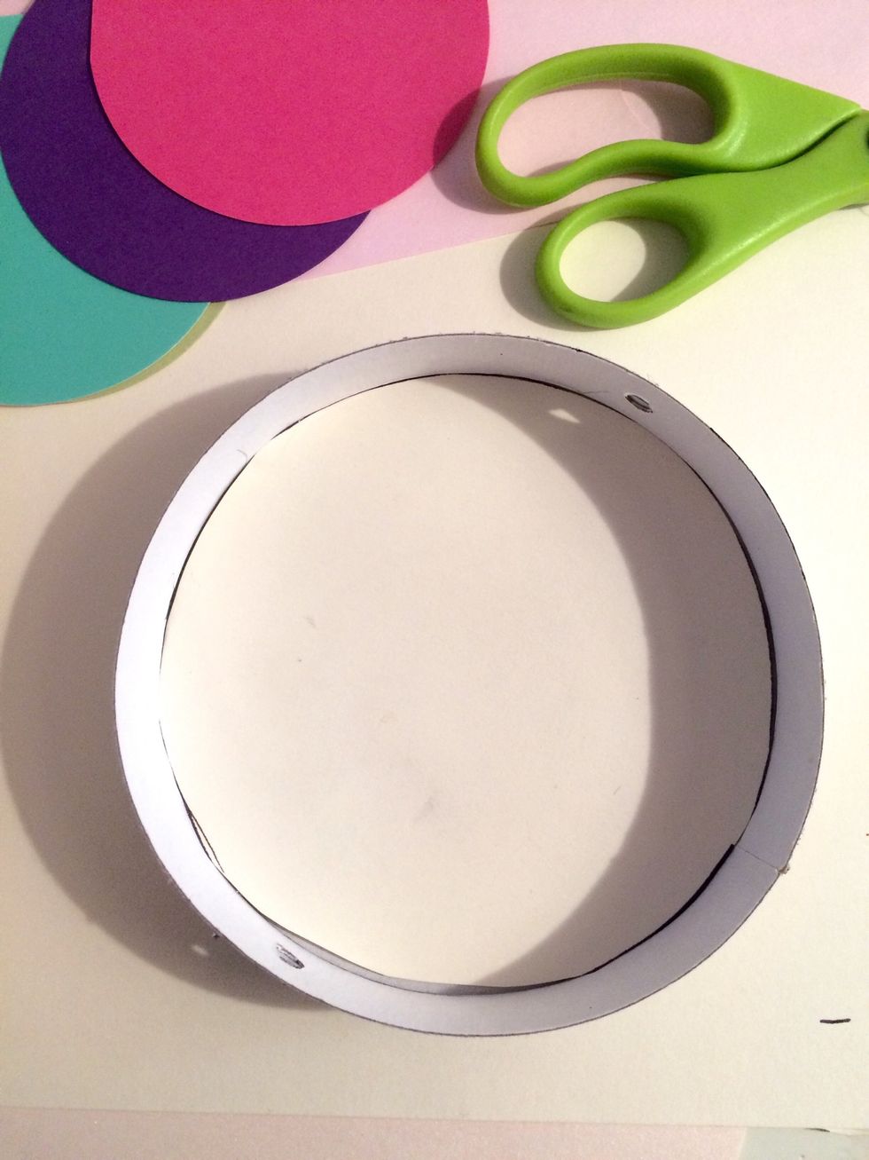 Then cut out a circle of light brown paper the size of the bottom of the box, and glue it down.