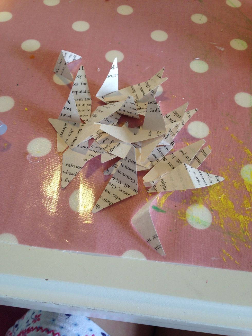 Then cut out triangles from a page if a book
