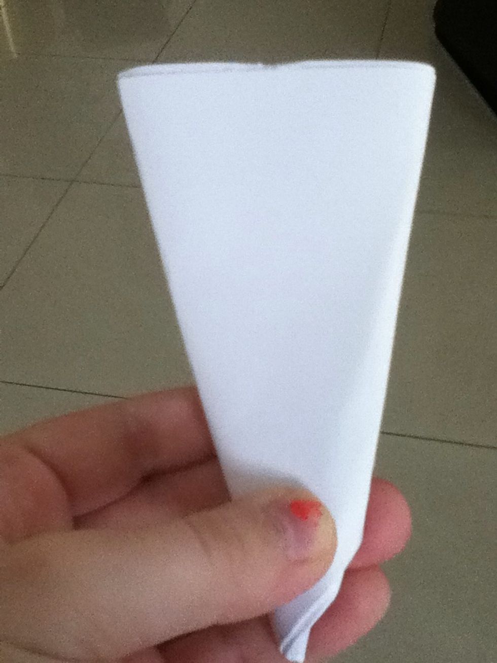 Then cut the small triangles which are at the top of the cone