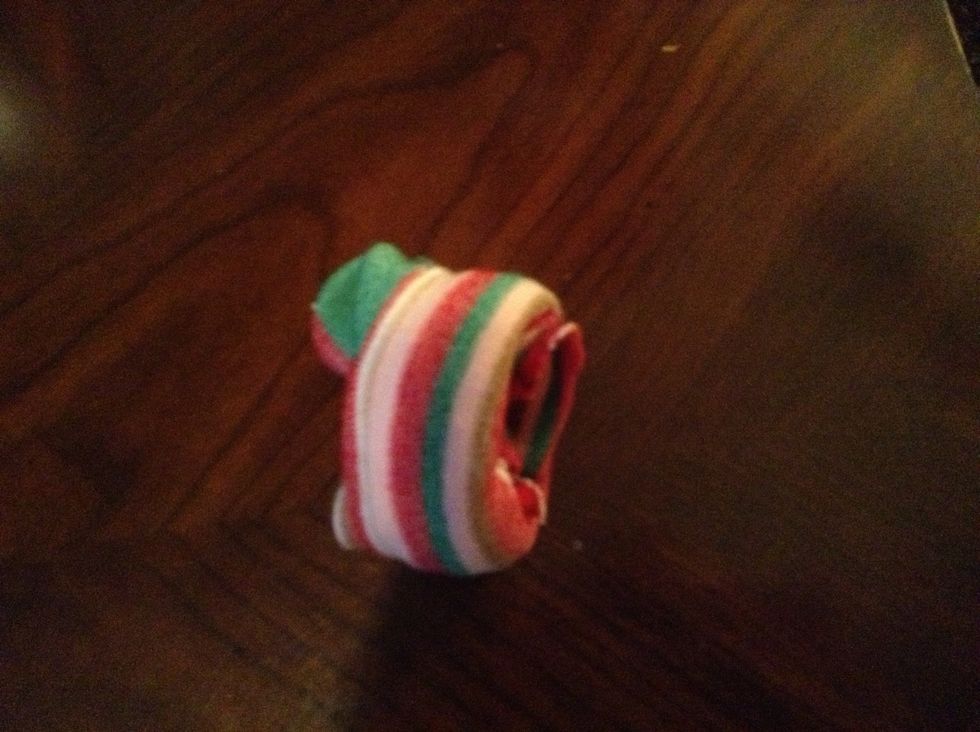 Then cut the toe off a long sock. After that roll it up in a doughnut shape.