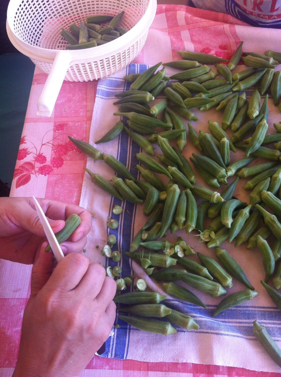 Then cut tip and top of the okra and put a dint just in the middle