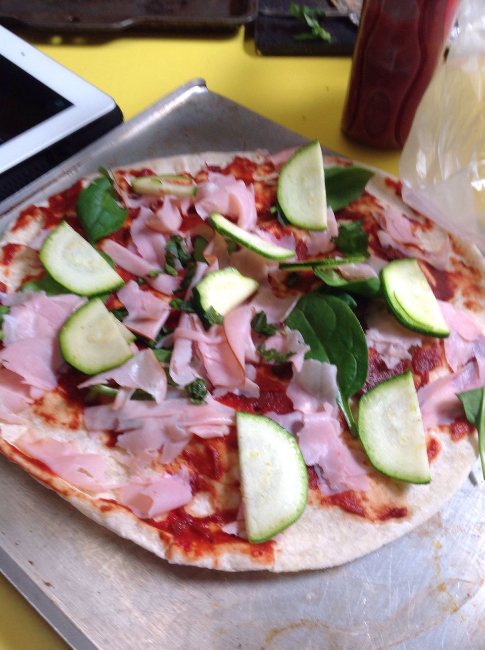 Then cut up some zucchini  into slices and put them on your pizza