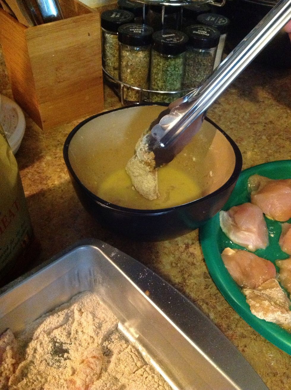 Then dip chicken chunk into egg mixture evenly.