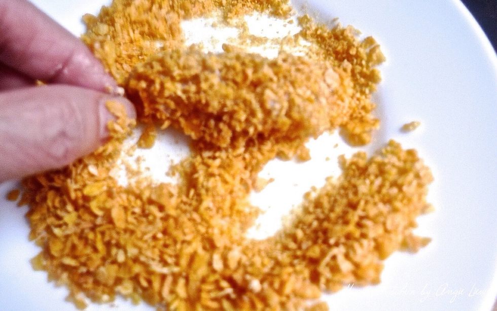 Then dip in the cornflake crumbs.