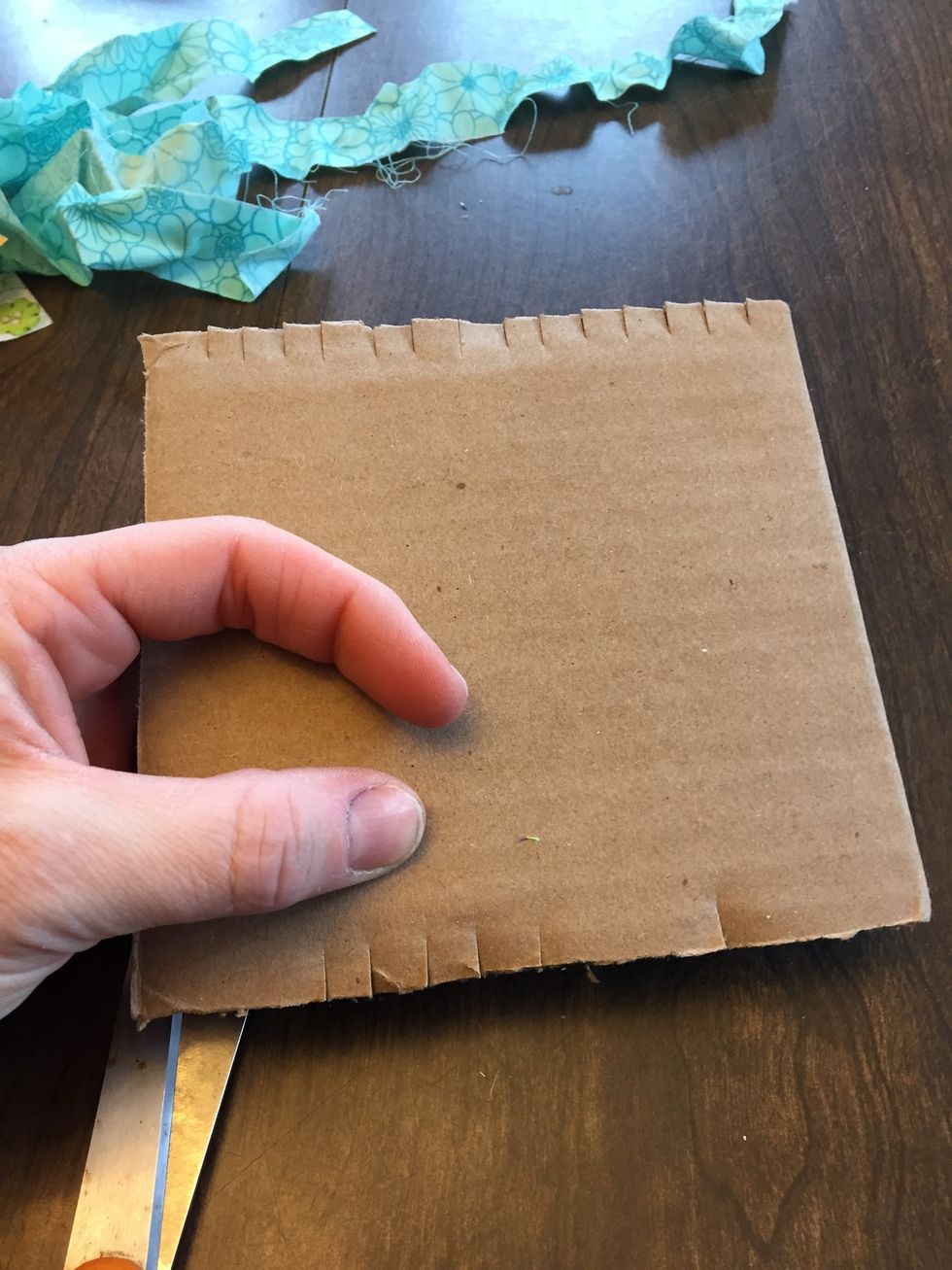 Then divide each of those sections in half again, and then again until you half small slits cut about 1/4" apart along both top and bottom edges. Doesn't have to be perfect, approximate is fine.