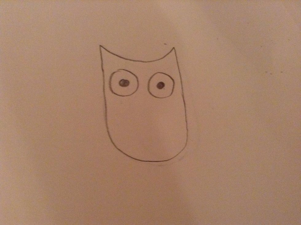 Then do 2 big circles and 2 smaller circles inside the bigger ones