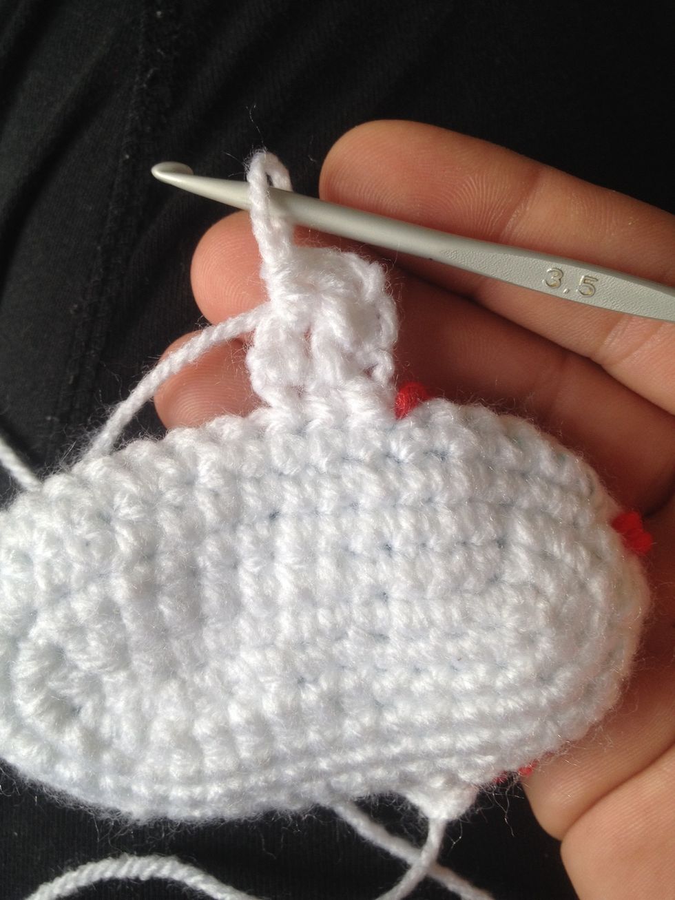 Then do a half double crochet in next stitch and then a slip stitch in the next stitch