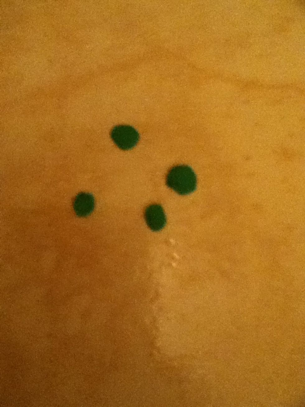 Then do green pickles by taking green playdoh then making four little circles