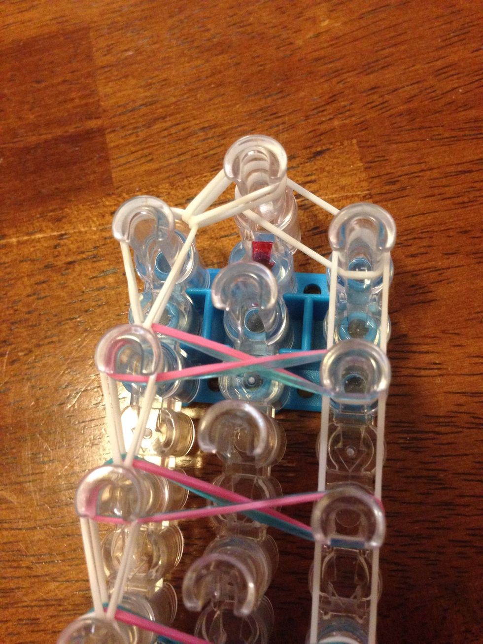 Then do the same thing, just to the top middle pin.