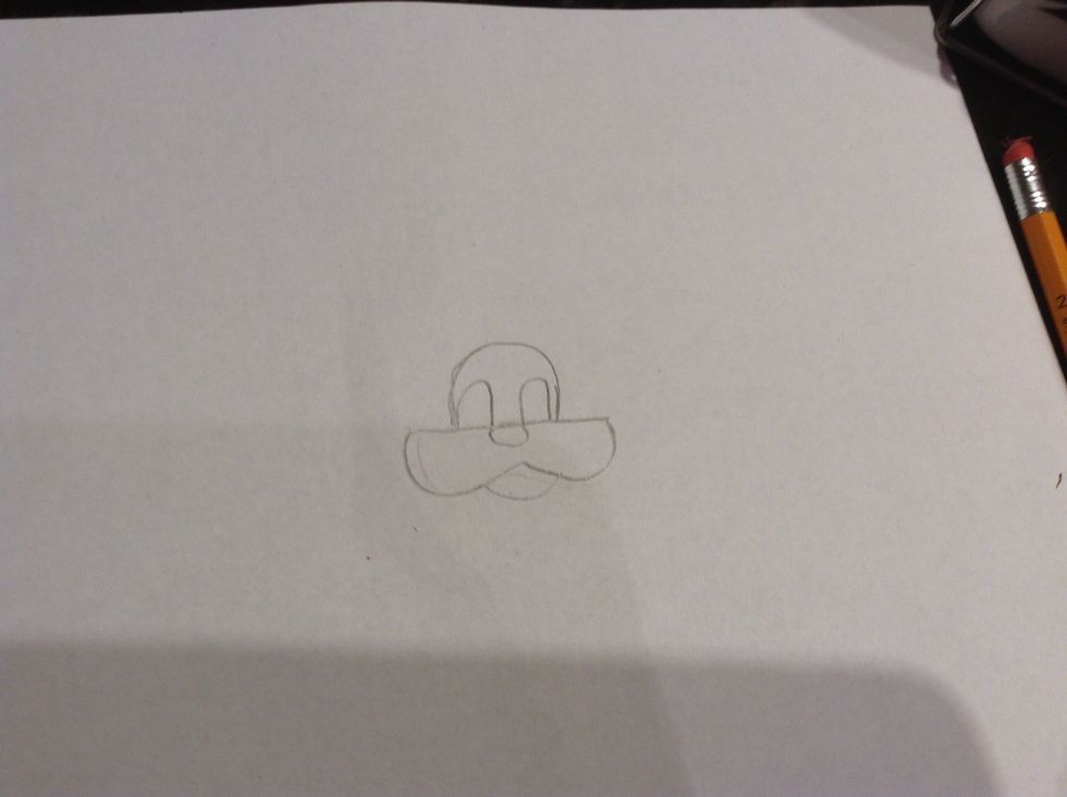 Then do to smaller bumps in the 1 big bump and draw a circle for the nose