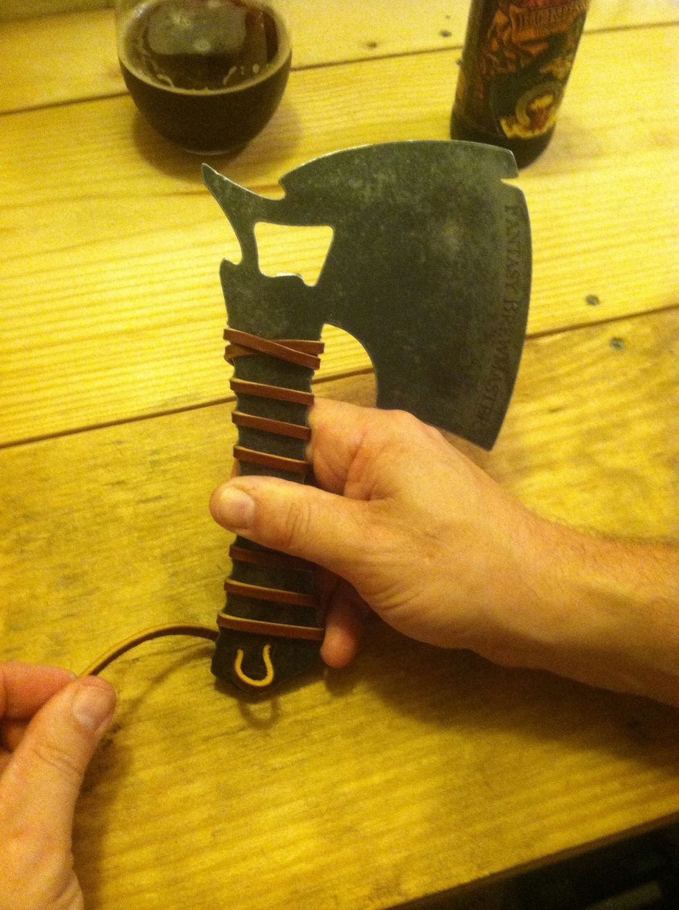 Then down through the next eye hole leaving a loose opening to tie off with.