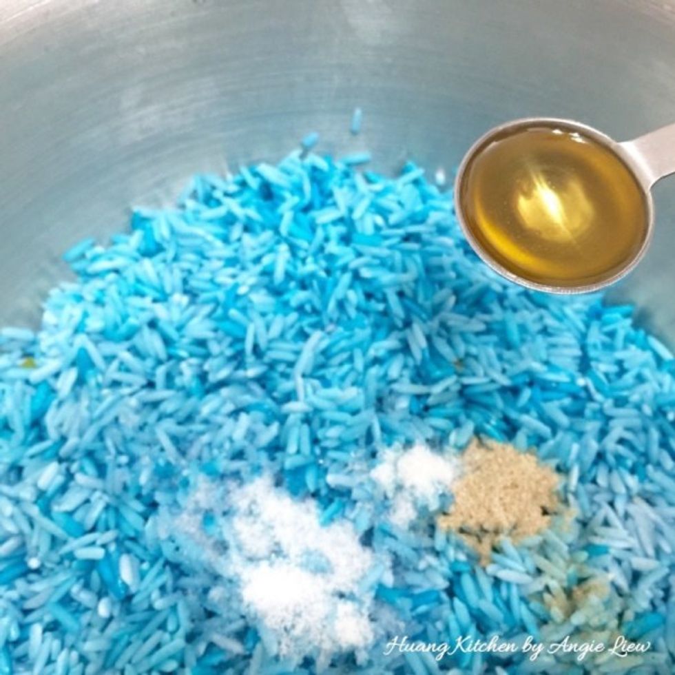 Then drained well the soaked blue coloured rice, add seasonings and mix well.