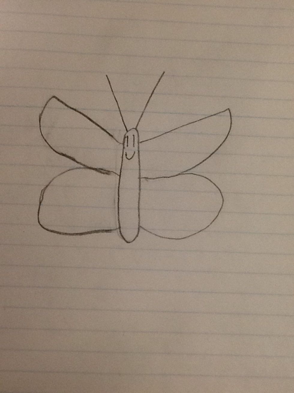 Then draw a face on the butterfly.