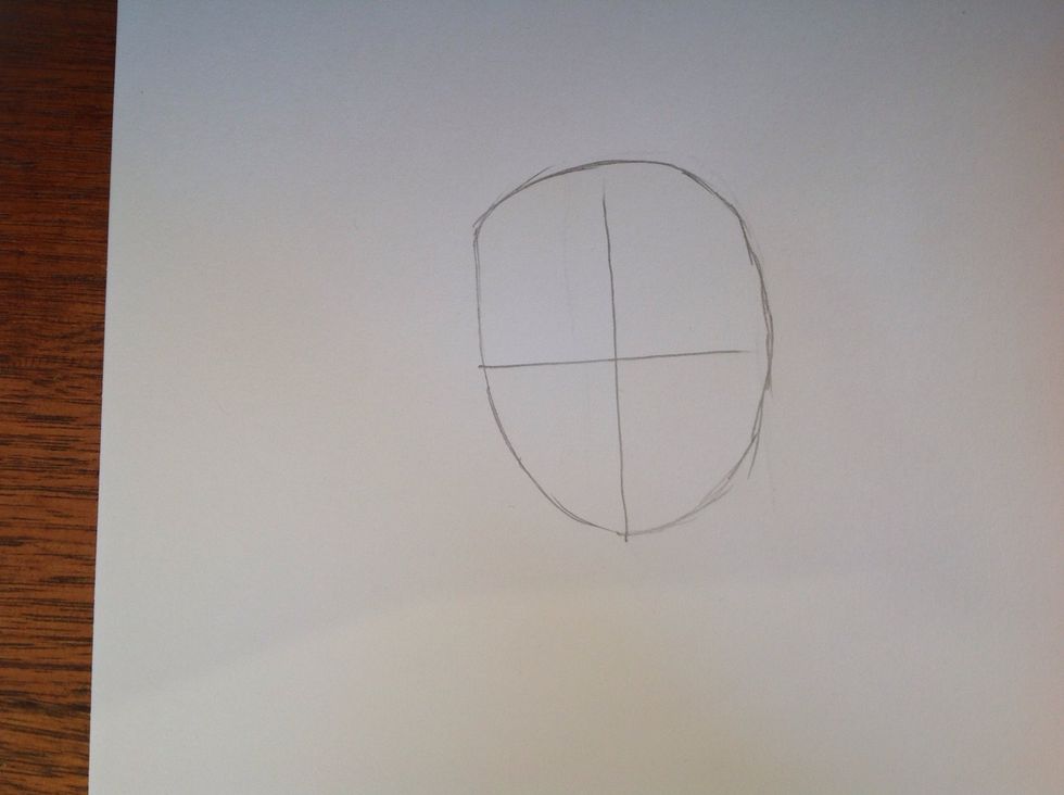 Then draw a head like shape around the cross. This will form the head.