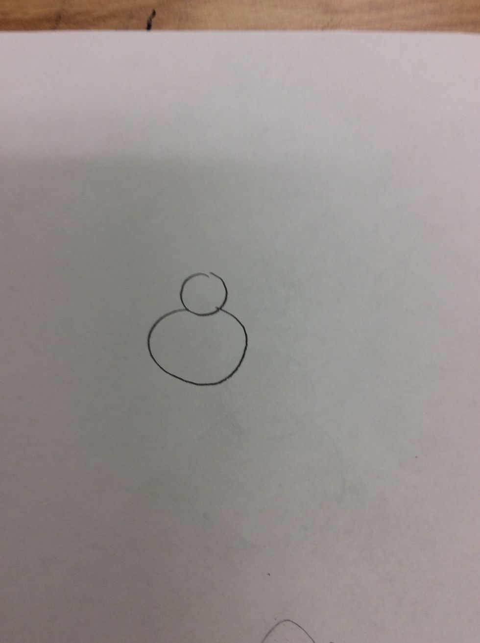 Then draw a medium sized circle under the small circle.