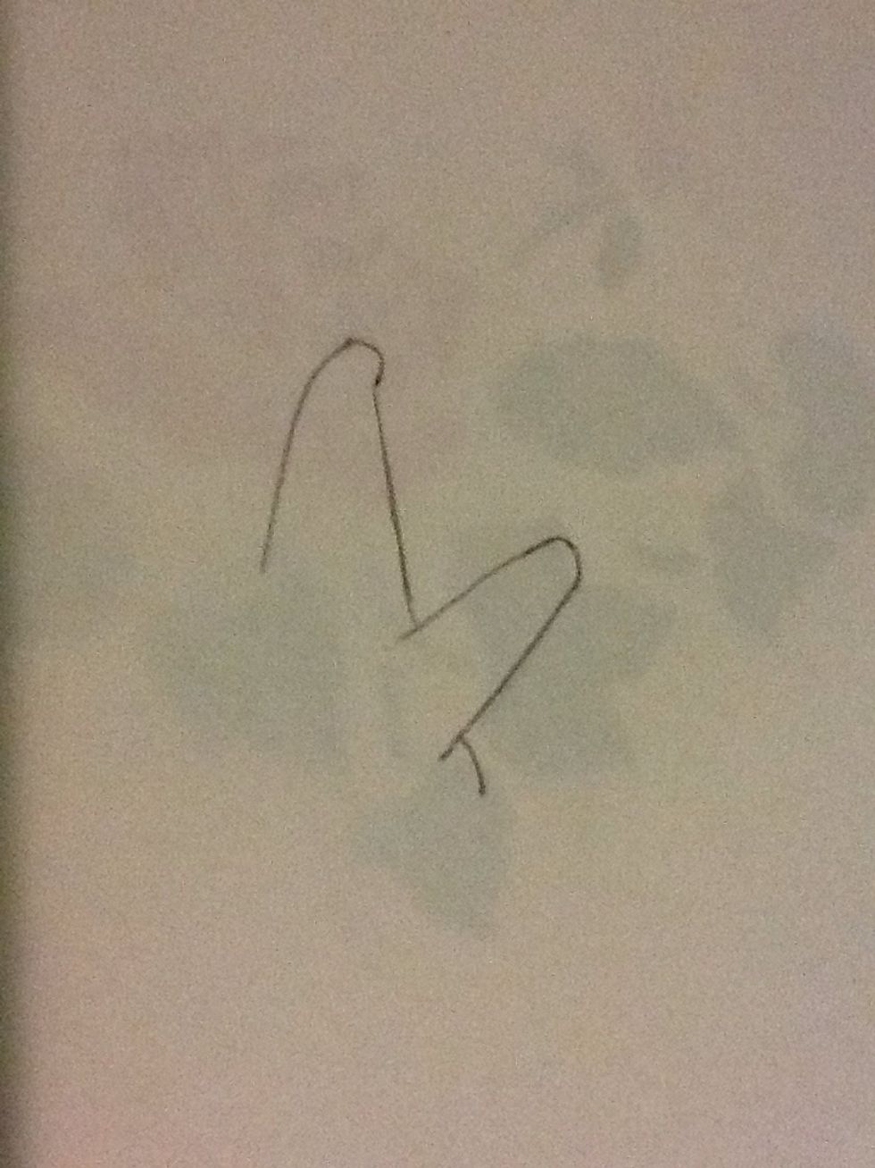 Then draw a slightly curved line to show the side of his body.