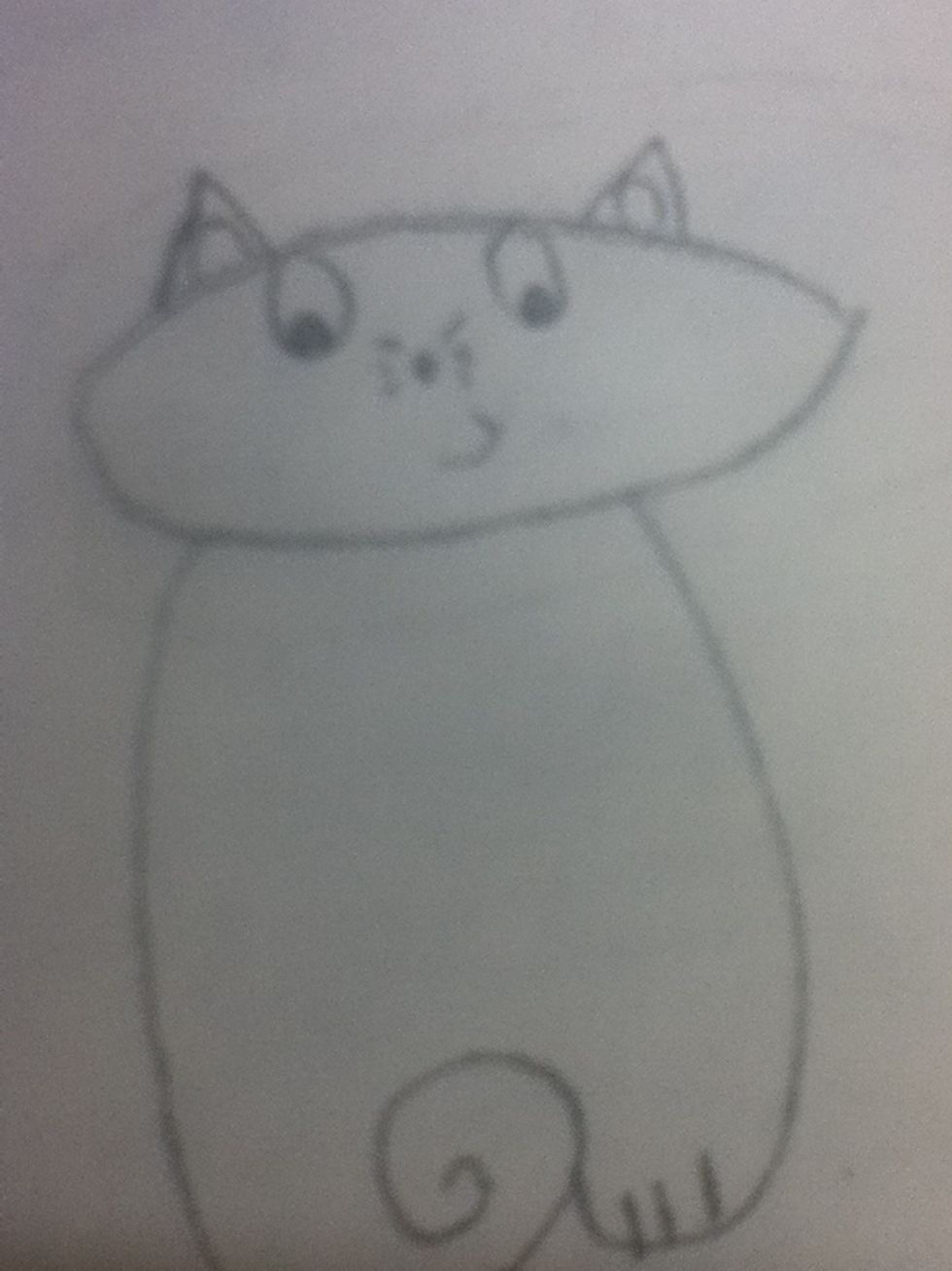Then draw a smile, a nose with whiskers and eyes.