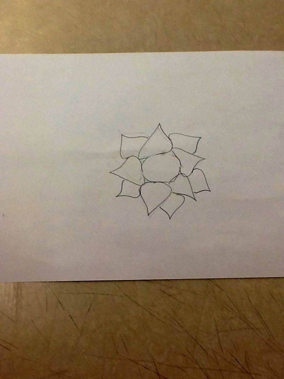 Then, draw half a raindrop in the spaces that the 5 raindrops created.