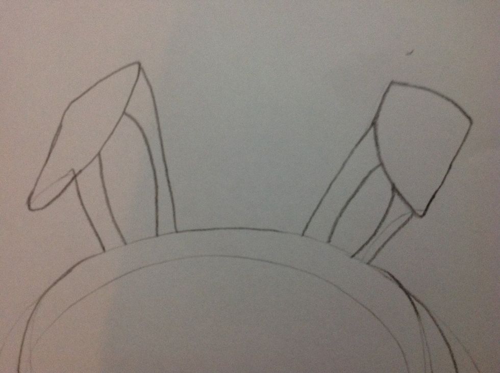 Then draw the bunny ears like this. And put circles in them.