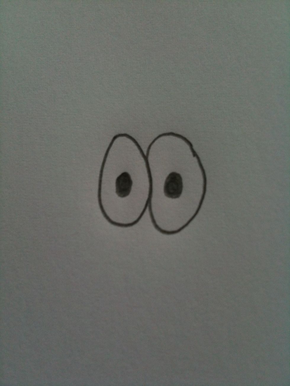 Then draw two pupils inside the ovals to make them look like eyes.